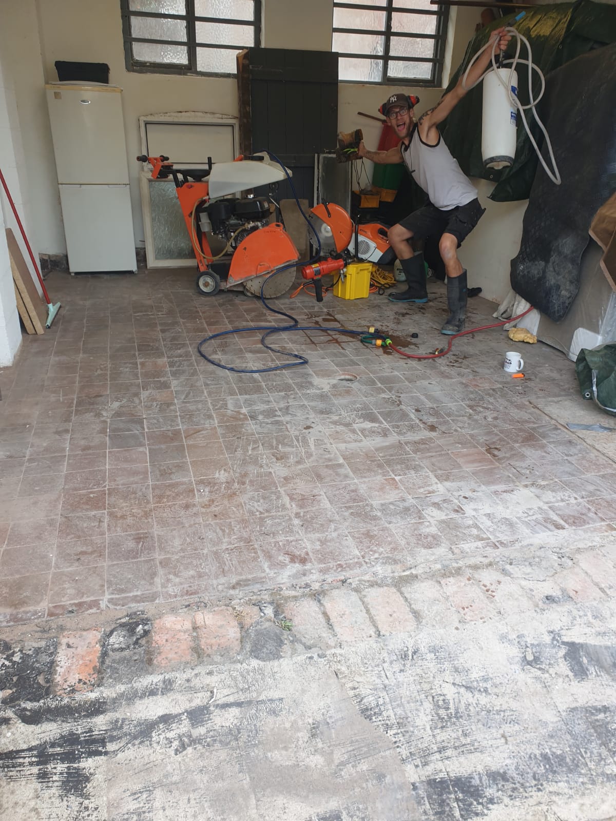 Garage floor prepped for breaking out and re-screeding