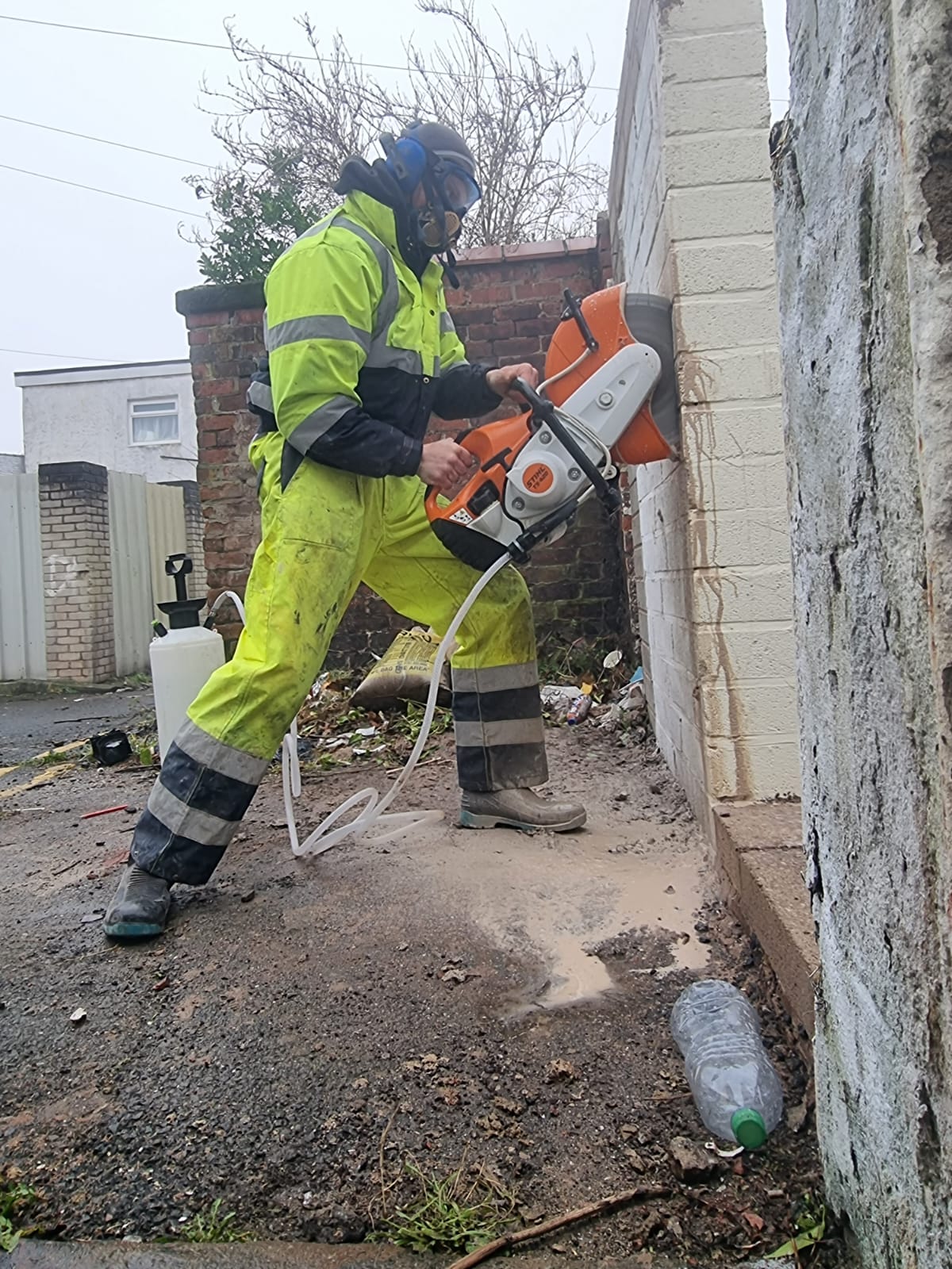 Diamond cutting a doorway opening through a blockwork wall