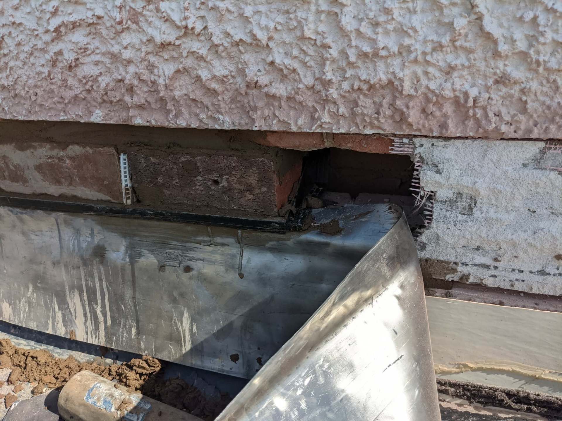 Lead flashing & brick repair to roof abutment