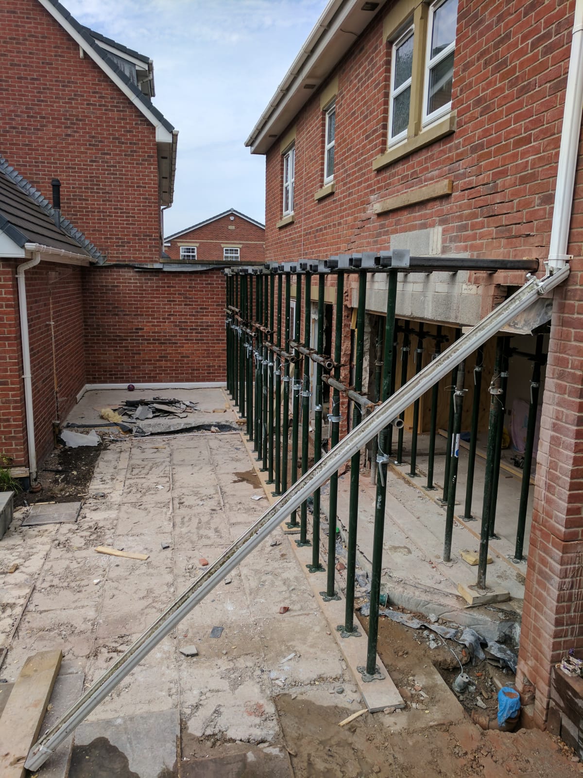 Rear extension structural works — acrow props supporting steel beams